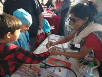 Volunteering at the barrett jackson COX STEM event with UACOMP