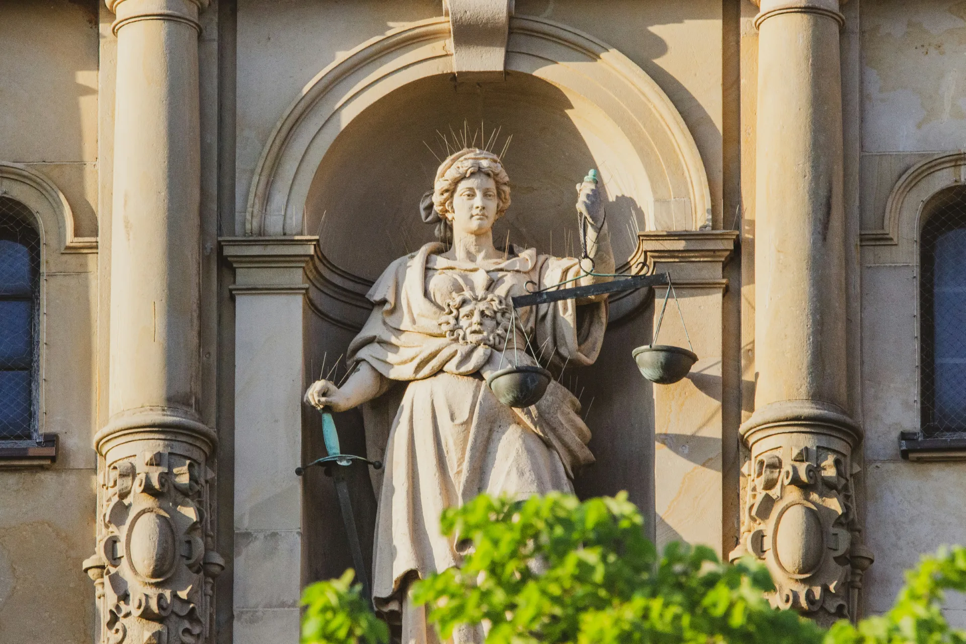 Statue of Lady Justice holding a sword and scales